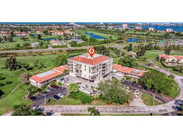 Aerial view of condo community showcasing building location and surrounding landscape at 6219 Palma Del Mar S Blvd # 114, St Petersburg, FL 33715