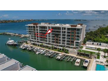 Luxury condo building with waterfront views and private boat slips at 920 N Osceola Ave # 507, Clearwater, FL 33755