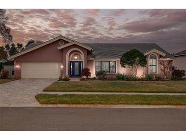 Beautiful two-story home with landscaped yard and attached garage at 1811 Stonebrook Ln, Safety Harbor, FL 34695
