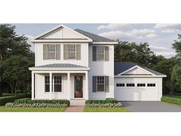 Two-story home with white siding, gray shutters, and a two-car garage at 3125 14Th N St, St Petersburg, FL 33704