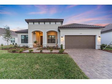 Beautiful one-story home with a two-car garage and landscaped yard at 5225 Caserta Ct, Palmetto, FL 34221