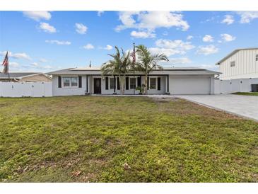 Updated single story home with a large front yard and attached garage at 8334 139Th Ln, Seminole, FL 33776