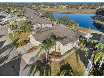 Aerial view of a house and golf course community at 2029 Inverness Greens Dr # 2029, Sun City Center, FL 33573
