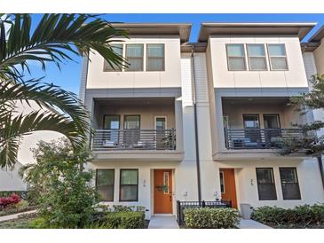 Modern two-story townhouses with private balconies and landscaped grounds at 2511 N Grady Ave # 26, Tampa, FL 33607