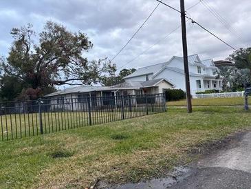 Ranch style home with a large yard and carport at 5 W Spanish Main St, Tampa, FL 33609