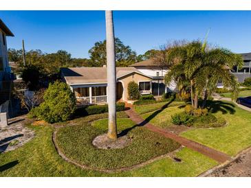 Aerial view of a charming house with a landscaped yard and walkway at 2834 Coffee Pot Ne Blvd, St Petersburg, FL 33704