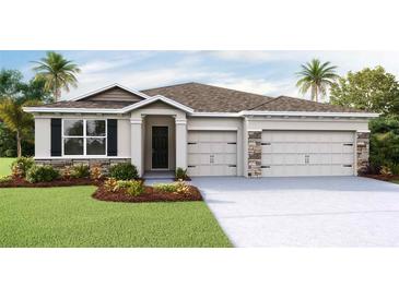 Two-story home with a two-car garage and stone accents at 3418 Hazel Hollow Way, Plant City, FL 33565