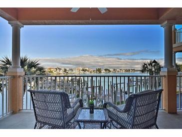 Relaxing balcony with waterfront views and seating for two at 530 S Gulfview Blvd # 205, Clearwater Beach, FL 33767