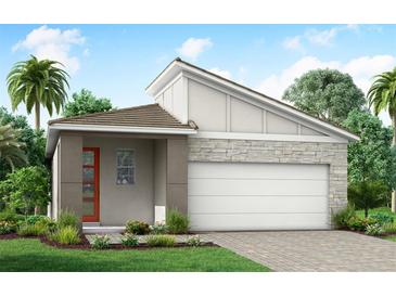 One-story home with modern design, gray exterior, orange door, and stone accents at 17777 Solstice Ave, Venice, FL 34293