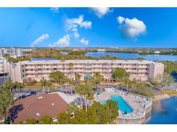 Aerial view of waterfront condo community with pool and lush landscaping at 6315 Shoreline Dr # 3202, St Petersburg, FL 33708
