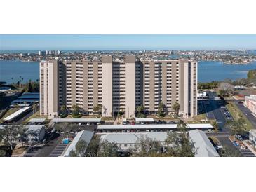 Aerial view of a high-rise building with water and city views at 7050 Sunset S Dr # 211, South Pasadena, FL 33707