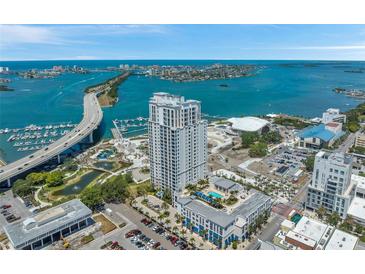 Aerial view of waterfront high-rise building with pool and marina at 331 Cleveland St # 315, Clearwater, FL 33755