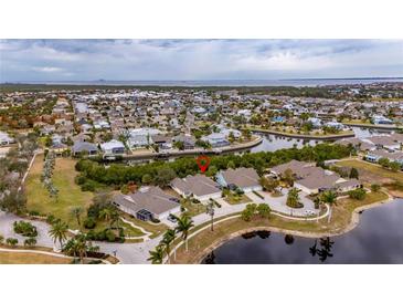 Aerial view of waterfront community, showcasing home location and surrounding area at 5610 Golden Isles Dr, Apollo Beach, FL 33572