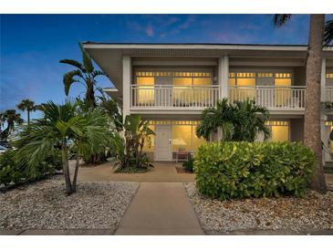 Two-story building exterior with walkway and landscaping at 611 Destiny Dr # 216, Ruskin, FL 33570