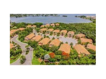 Aerial view of Banyan Bay community, showing lakefront location and numerous townhouses at 130 Banyan Bay Dr, St Petersburg, FL 33705