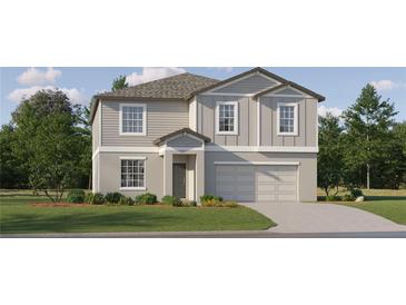 Two-story house with gray siding, a two-car garage, and landscaping at 3637 Forest Path Dr, Plant City, FL 33565