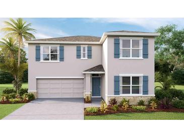 Two-story house with gray siding, blue shutters, and a two-car garage at 7196 Beaverhead Ln, Land O Lakes, FL 34638