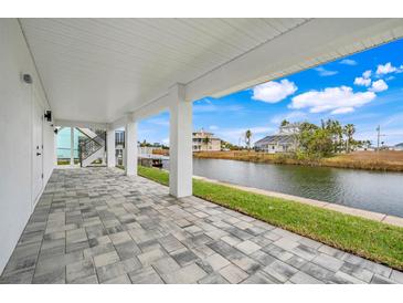 Covered patio overlooking a canal with water views at 3431 Palometa Dr, Hernando Beach, FL 34607