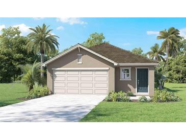 One-story home with two-car garage, light brown exterior, and dark brown roof at 36100 Sunflower Hill Dr, Zephyrhills, FL 33541