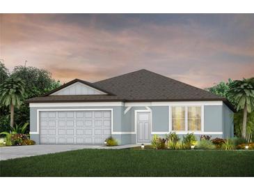 Newly constructed home with a two-car garage and landscaped front yard at 12815 Wanderlust Pl, Parrish, FL 34219