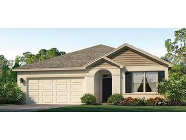 Single-story house with beige siding, gray roof, and a two-car garage at 17217 Wheatberry Blvd, Parrish, FL 34219
