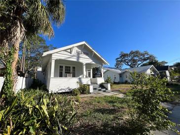 Charming white bungalow home with a spacious front porch at 1105 W De Leon St, Tampa, FL 33606