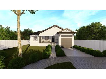 Modern house with a white exterior, gray garage door, and a paved driveway at 3307 W Oak Ave, Plant City, FL 33563