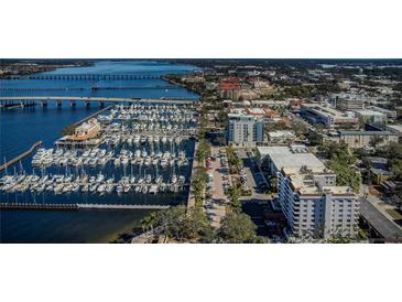 Aerial view of waterfront property with marina and city skyline at 1400 1St W Ave # 306, Bradenton, FL 34205