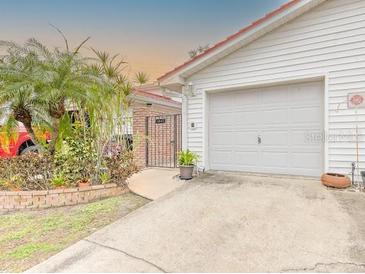 Attached garage with ample parking space at 1447 Water View W Dr, Largo, FL 33771