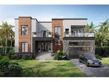 Modern two-story home with wood and stone accents, balconies, and a two-car garage at 4621 W El Prado Blvd, Tampa, FL 33629