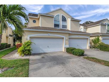 Two-story townhome with double garage and landscaped yard at 1050 Starkey Rd # 2701, Largo, FL 33771