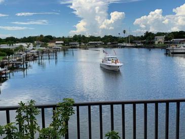 Scenic waterfront view with boats and lush greenery at 3753 46Th S Ave # 7, St Petersburg, FL 33711