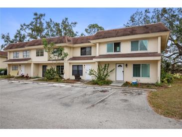 Two-story condo building with parking and landscaping at 314 Barlow Ave # 73, Sarasota, FL 34232