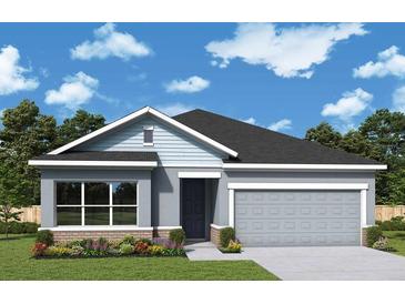 One-story home with gray siding, dark blue door, and two-car garage at 11853 Mile Marsh Dr, Riverview, FL 33569