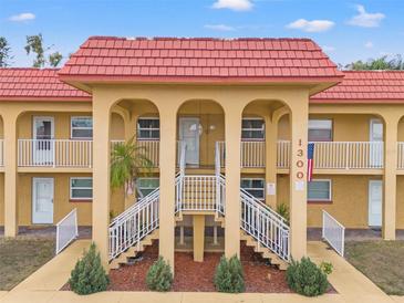 Building exterior featuring a Spanish-style roof and a grand staircase at 1300 S Hercules Ave # 12, Clearwater, FL 33764