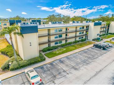 Two-story condo building with parking and landscaping at 14130 Rosemary Ln # 2203, Largo, FL 33774