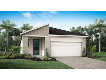 Single-story home with attached garage and landscaping at 31394 Pendleton Landing Cir, Wesley Chapel, FL 33545