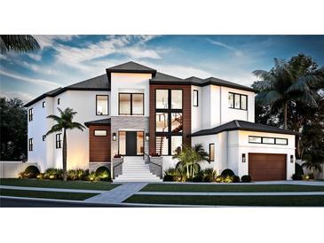 Stunning modern home with two-toned exterior, and palm trees at 2622 N Dundee St, Tampa, FL 33629