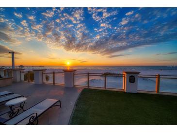 Stunning sunset over the ocean, seen from a private balcony at 470 Mandalay Ave # 305, Clearwater Beach, FL 33767