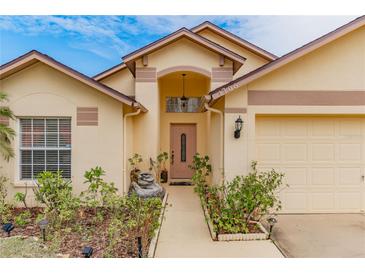 Attractive single-story home with a two-car garage and well-manicured landscaping at 1706 Kirtley Dr, Brandon, FL 33511