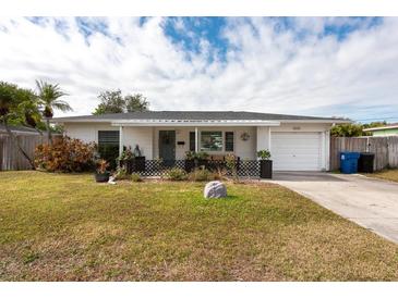 Charming ranch home with well-manicured lawn and driveway at 6500 Dr Martin Luther King Jr N St, St Petersburg, FL 33702