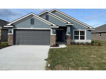 Curb appeal abounds in this charming new home! at 13251 Ogden Glade Rd, Dade City, FL 33525