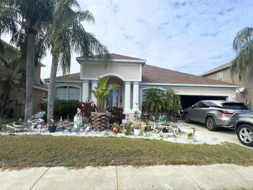 Single-Gathering home with landscaped yard and attached garage at 10537 Sky Flower Ct, Land O Lakes, FL 34638