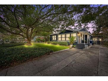 Charming Bungalow with a spacious front yard and mature tree at 1217 E Flora St, Tampa, FL 33604