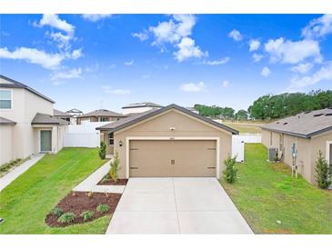 Aerial view of a house and surrounding neighborhood at 5403 Fez Ct, Brooksville, FL 34602