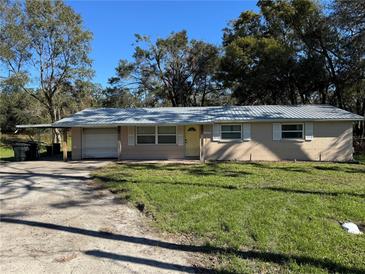 Ranch style home with carport and yard at 37329 Hannah Ln, Zephyrhills, FL 33542