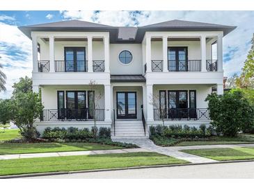 Stunning two-story home with white exterior and black accents at 200 Cordova Ne Blvd, St Petersburg, FL 33704