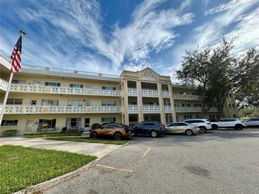 Two-story condo building with ample parking and landscaping at 2285 Israeli Dr # 1, Clearwater, FL 33763