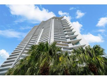 Modern high-rise building with palm trees and blue sky at 175 1St S St # 3102, St Petersburg, FL 33701