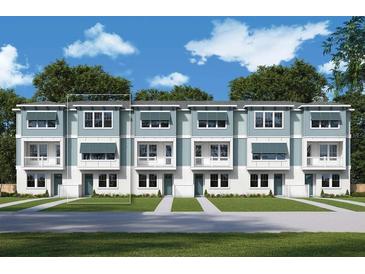 Modern 3-story townhouses with balconies and a landscaped lawn at 2109 1St N Ave, St Petersburg, FL 33713